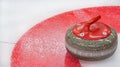 Curling granite stone on ice rink. Winter team olympic sport