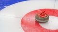 Curling granite stone on ice rink. Winter team olympic sport Royalty Free Stock Photo