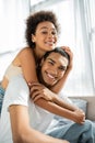 curly african american woman embracing happy