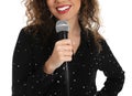 Curly African-American woman holding microphone on white background Royalty Free Stock Photo