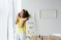 Curly african american woman talking on smartphone near laptop Royalty Free Stock Photo