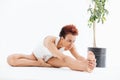 Curly african american young woman stretching and doing yoga exercises Royalty Free Stock Photo