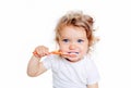 Curly baby toddler brushing teeth. Royalty Free Stock Photo