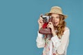 curly blonde woman holding retro vintage photo camera, Royalty Free Stock Photo