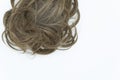 Curly brown hair isolated on white. Bottom copy space.