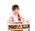 Curly child girl playing with kitten Royalty Free Stock Photo