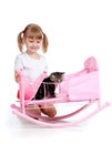 Curly child girl playing with kitten Royalty Free Stock Photo