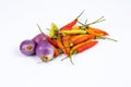 curly chili and red onion, shallots isolated on a white background Royalty Free Stock Photo