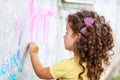 Girl draws on the wall