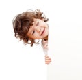 Curly funny child holding blank advertising