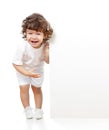 Curly funny girl holding blank advertising banner