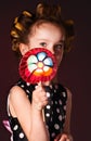 Curly girl with lollipop Royalty Free Stock Photo