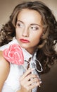 Curly girl with a lollipop in her hand Royalty Free Stock Photo