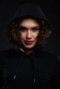 Curly girl wearing black hood