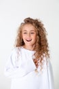 Curly girl in white long sleeve t-shirt