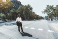 A curly guy in sunglasses passing the crosswalk Royalty Free Stock Photo