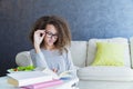 Curly hair teen girl reading book and eating salad Royalty Free Stock Photo