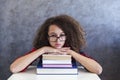 Curly hair teen girl rest from learning on books Royalty Free Stock Photo