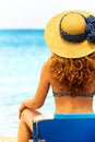 Curly haired woman looking at the sea Royalty Free Stock Photo