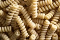 Curly Italian macaroni, wheat pasta products close-up