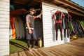 Curly man in swimsuit standing at the beach hut Royalty Free Stock Photo