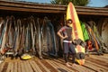 Curly man in swimsuit standing at the beach hut Royalty Free Stock Photo