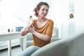 Curly mature woman having reddening after allergy to chemicals Royalty Free Stock Photo