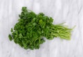 Curly parsley on a marble cutting board