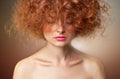 Curly Red Hair. Beautiful Fashion Woman Portrait Royalty Free Stock Photo