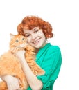 Curly red-haired girl with a red cat isolated Royalty Free Stock Photo
