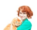 Curly red-haired girl with a red cat Royalty Free Stock Photo