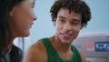 Curly teenager chatting friend closeup. Friendly hispanic guy enjoy conversation