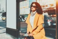 Curly tired woman with blank mock-up banner near Royalty Free Stock Photo