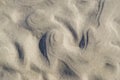 Curly, wavy sand pattern on beach Royalty Free Stock Photo