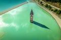 Curon Venosta. Submerged bell Tower in Graun im Vinschgau on Lake Reschen Alpine landscape aerial view