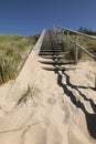 Wooden footpath through dunes at the Baltic sea inLithuania, Curonian Spit . Royalty Free Stock Photo