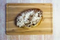 Currant bread on a wooden cutting board Royalty Free Stock Photo