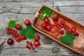 Currants, strawberries, cherries and raspberries on a rustic table Royalty Free Stock Photo