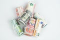 Currencies and money exchange trading concepts. The rolls of different currencies US Dollar, Euro and Chinese yuan banknotes Royalty Free Stock Photo