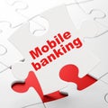 Currency concept: Mobile Banking on puzzle background Royalty Free Stock Photo