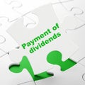 Currency concept: Payment Of Dividends on puzzle background Royalty Free Stock Photo