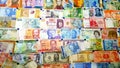 Currency of different countries background. Colorful banknotes of different countries as background close up Royalty Free Stock Photo