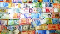 Currency of different countries background. Colorful banknotes of different countries as background close up Royalty Free Stock Photo