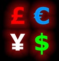 Four Neon Currency Symbols on Black Royalty Free Stock Photo