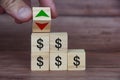 Currency fluctuation with dollar sign on wooden blocks. Currency fluctuation and wealth concept