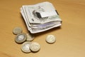 Currency In Money Clip And Coins On Table Royalty Free Stock Photo