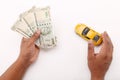 Indian currency notes and toy car in the hands bank loan concept