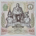 A bank note from Thailand depicting a picture of the late King, value 60 Thai Baht. Royalty Free Stock Photo