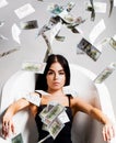 Currency, women, winning. Bank concept. Sexy female and dollar bills. Woman with lot of money. Millionaire woman lying