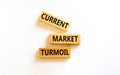 Current market turmoil symbol. Concept words Current market turmoil on wooden blocks on a beautiful white table white background. Royalty Free Stock Photo